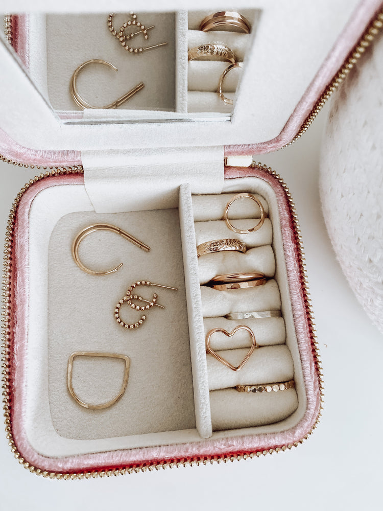 Pink jewelry box organized for travel